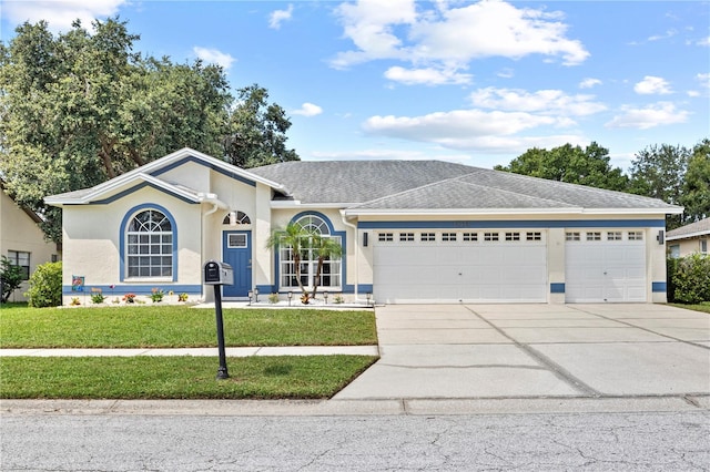 ranch-style house with a front lawn and a garage