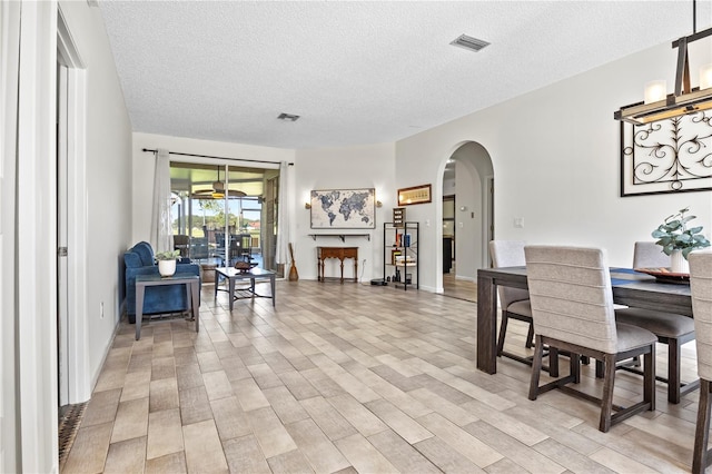 dining space featuring a textured ceiling