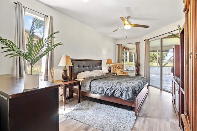 bedroom with ceiling fan, access to exterior, and light hardwood / wood-style flooring