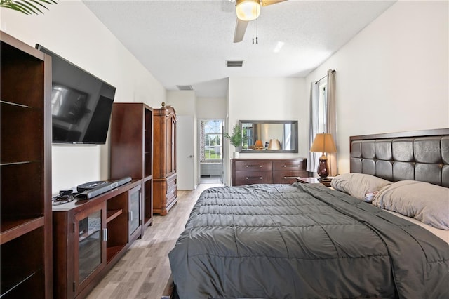 bedroom featuring ceiling fan and light wood-type flooring