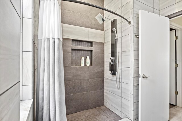 bathroom featuring curtained shower