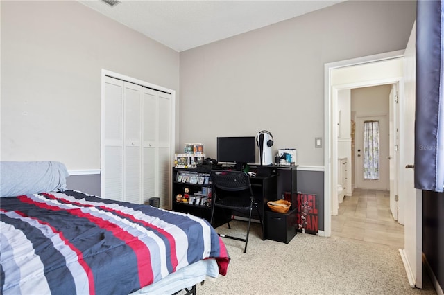 carpeted bedroom featuring a closet