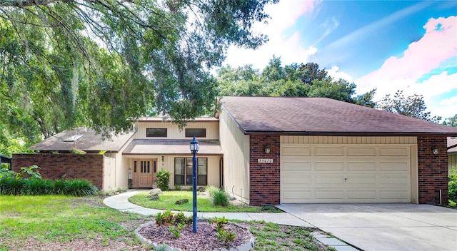 view of front of home with a garage and a front yard