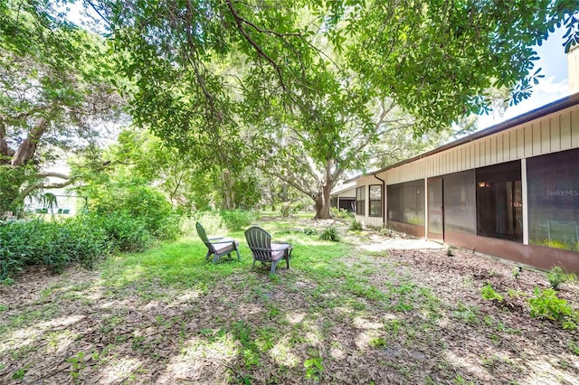 view of yard featuring a sunroom