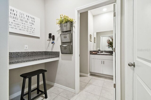 bathroom with vanity and tile patterned flooring