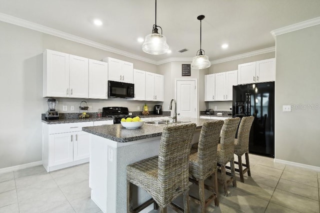 kitchen featuring white cabinetry, black appliances, a kitchen breakfast bar, an island with sink, and crown molding