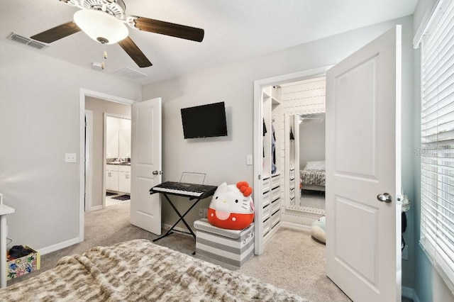 bedroom featuring light carpet and ceiling fan