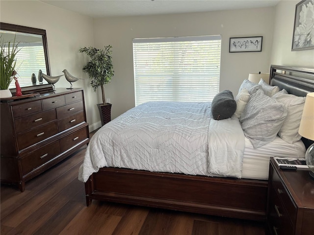 bedroom featuring dark hardwood / wood-style flooring