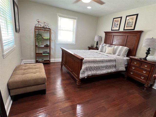 bedroom featuring ceiling fan and dark hardwood / wood-style floors