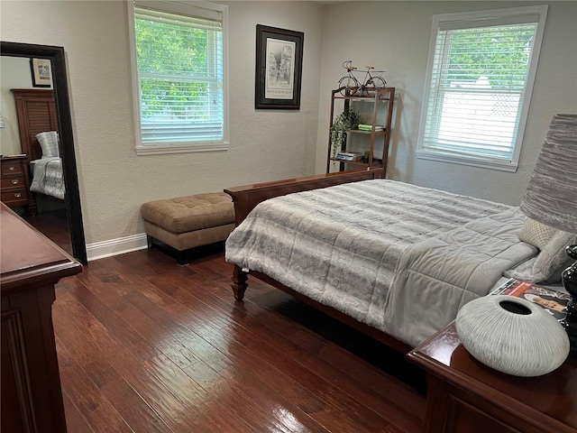 bedroom featuring dark hardwood / wood-style flooring