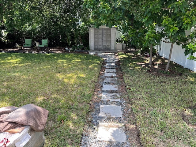 view of yard featuring a storage unit