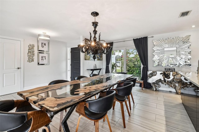 dining area featuring a chandelier