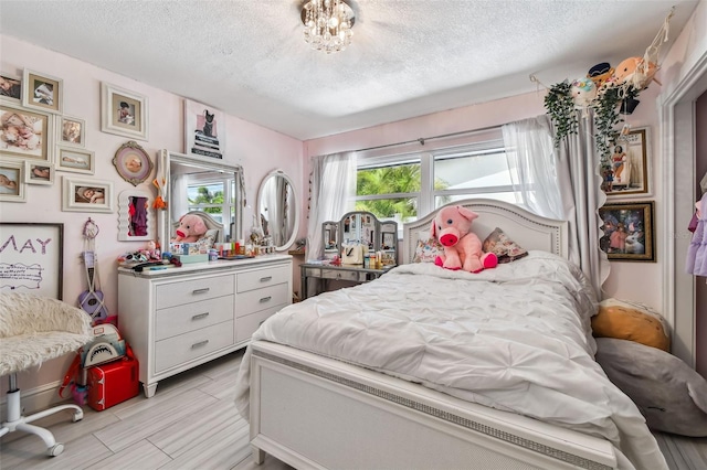 bedroom featuring a textured ceiling