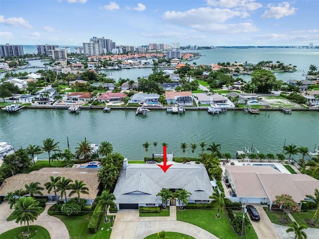 birds eye view of property featuring a water view