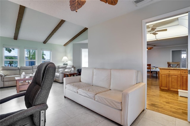 tiled living room with lofted ceiling with beams and ceiling fan