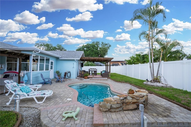 view of swimming pool featuring a patio area