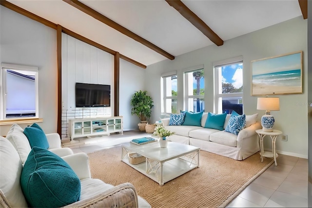 living room featuring lofted ceiling with beams and light tile patterned flooring