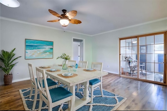 dining area featuring crown molding, ceiling fan, and hardwood / wood-style flooring