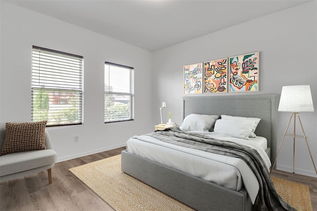 bedroom with hardwood / wood-style flooring