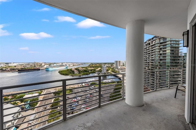 balcony featuring a water view