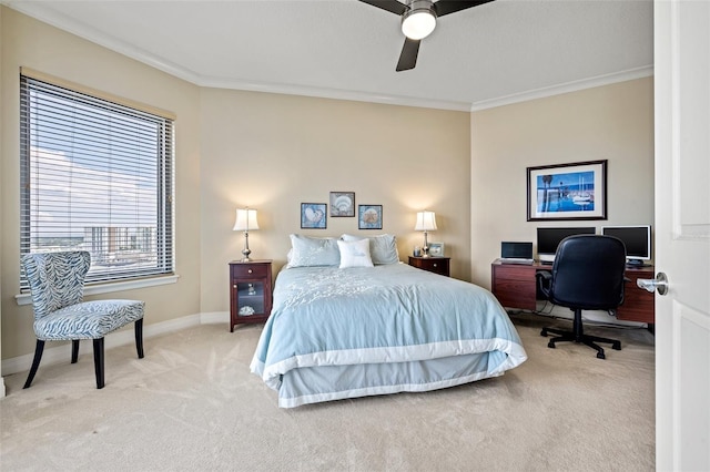 carpeted bedroom featuring ceiling fan and ornamental molding