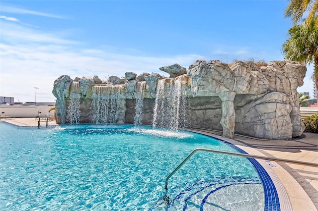 view of pool featuring pool water feature