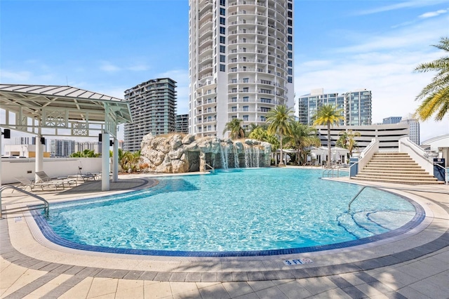 view of pool featuring a patio area and pool water feature