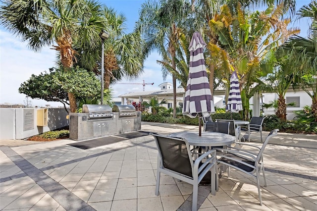 view of patio with a grill and an outdoor kitchen