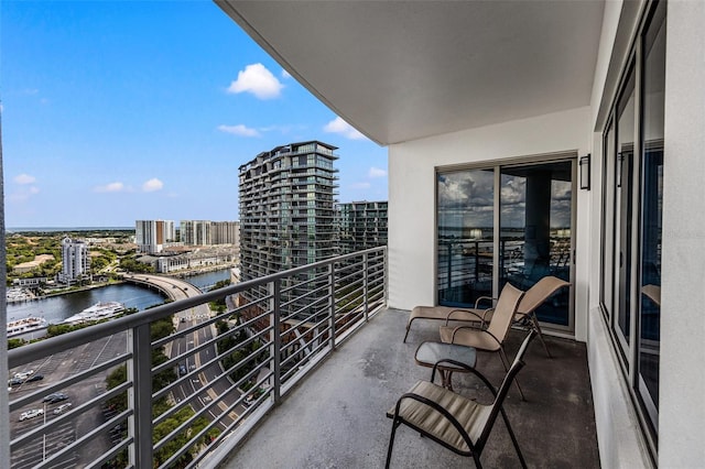 balcony featuring a water view