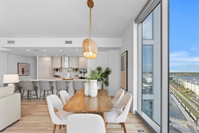 dining space featuring light hardwood / wood-style flooring