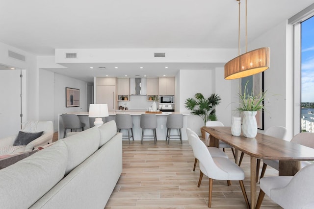 dining space featuring expansive windows