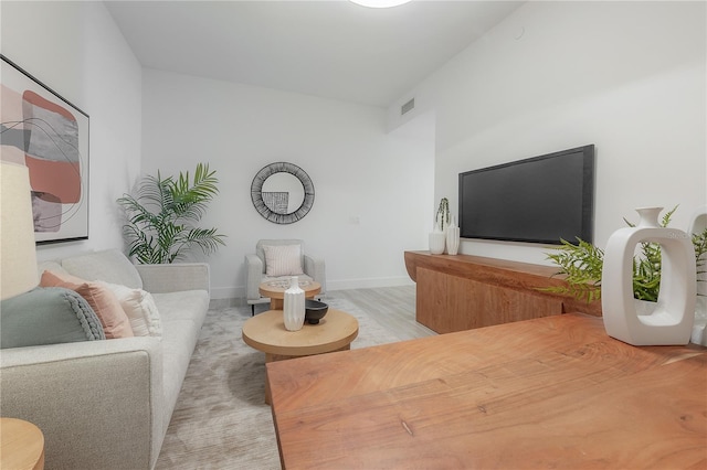 living room with light hardwood / wood-style floors