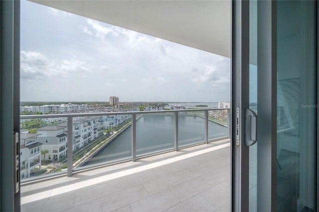 balcony featuring a water view