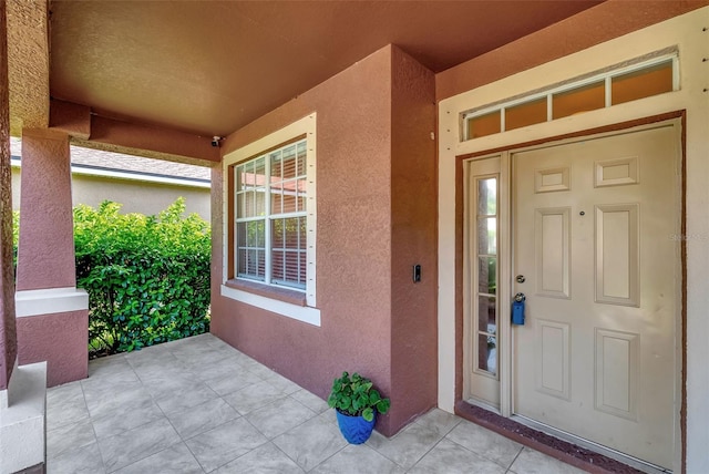 doorway to property with a porch