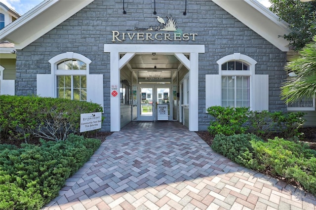 view of exterior entry featuring french doors