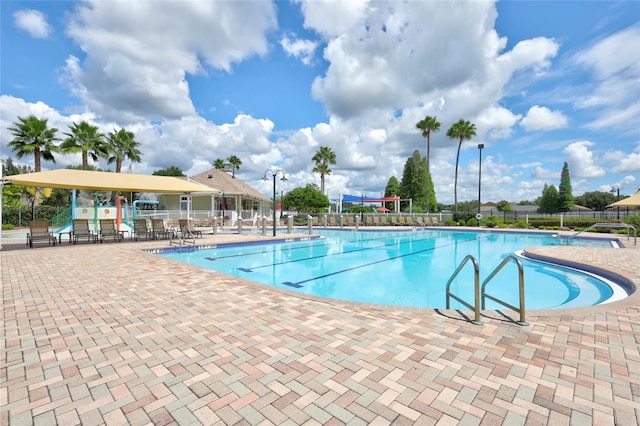 view of swimming pool featuring a patio area