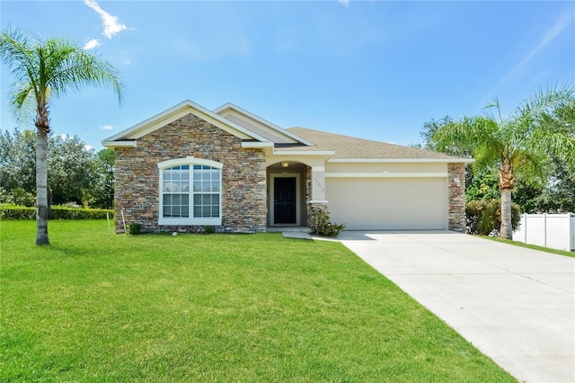 view of front of house featuring a garage and a front yard