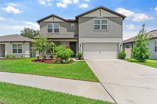 view of front of property with a garage and a front lawn