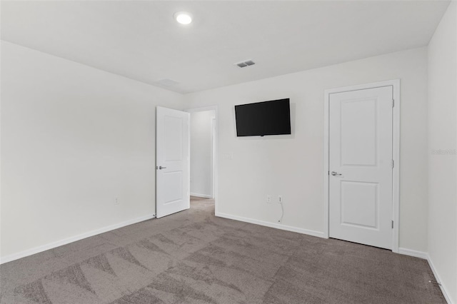 empty room with carpet flooring