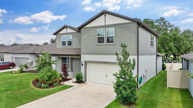 view of front of home with a garage and a front lawn