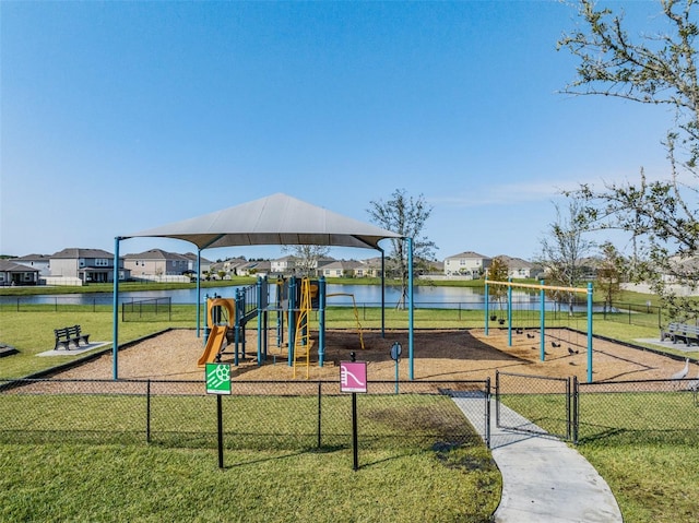 view of playground featuring a water view and a yard