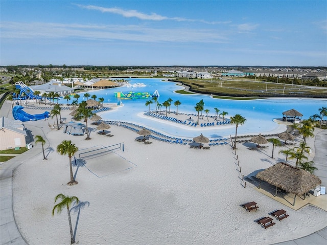 view of pool featuring a water view