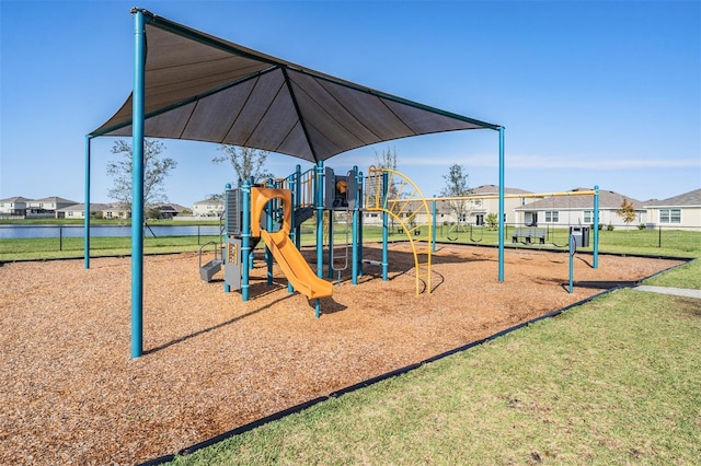 view of jungle gym featuring a lawn