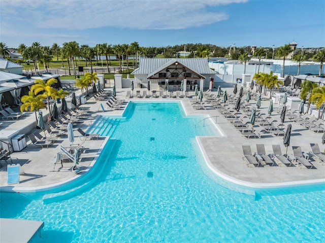 view of swimming pool with a patio