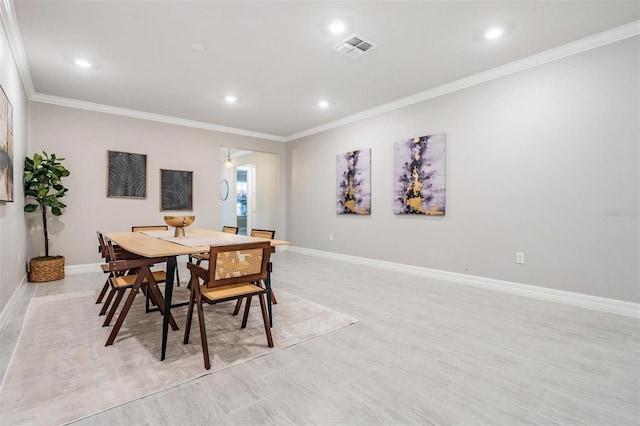 dining area with crown molding