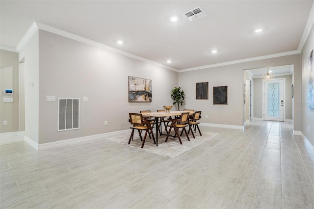 dining space with crown molding