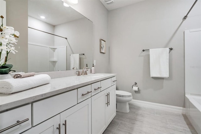 bathroom featuring toilet and vanity