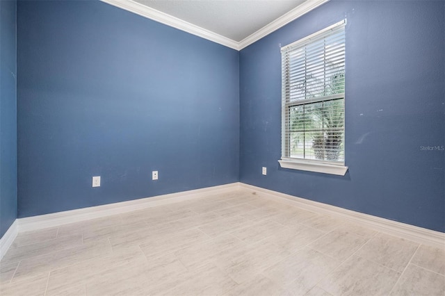 unfurnished room featuring crown molding