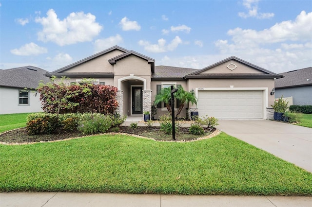 view of front of house with a garage and a front lawn