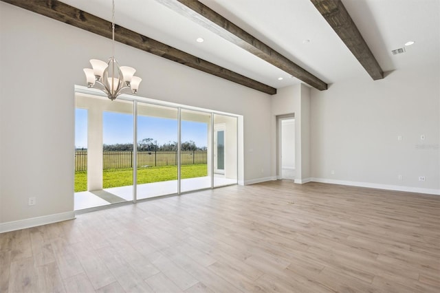 interior space with light hardwood / wood-style floors, a chandelier, and beamed ceiling